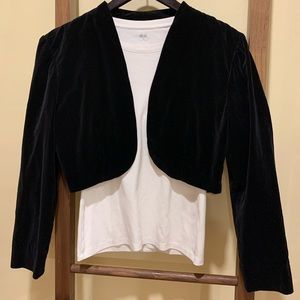 Vintage black velvet boléro jacket with a gentle puff sleeve at the shoulder
